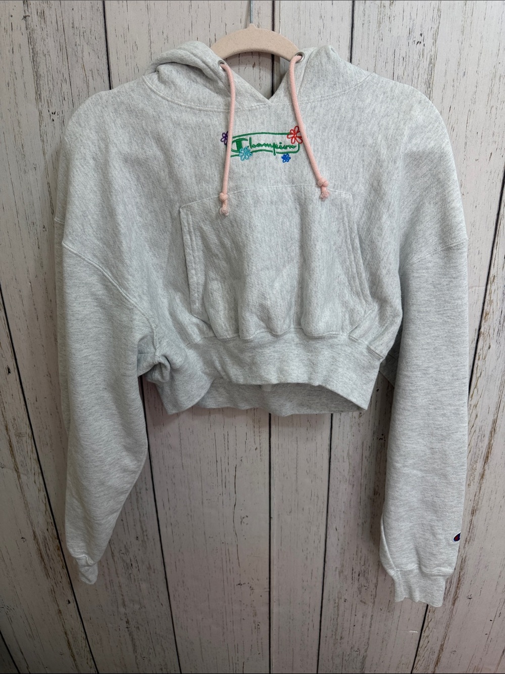 Champion Light Gray Cropped Hoodie with Pink Drawstrings and Floral Logo